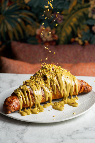 Croissant covered in pistachio